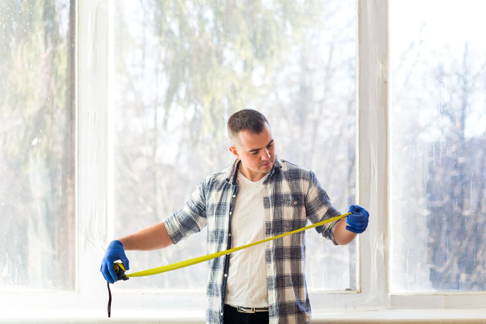 Home owner renovating windows with vacuum glazing