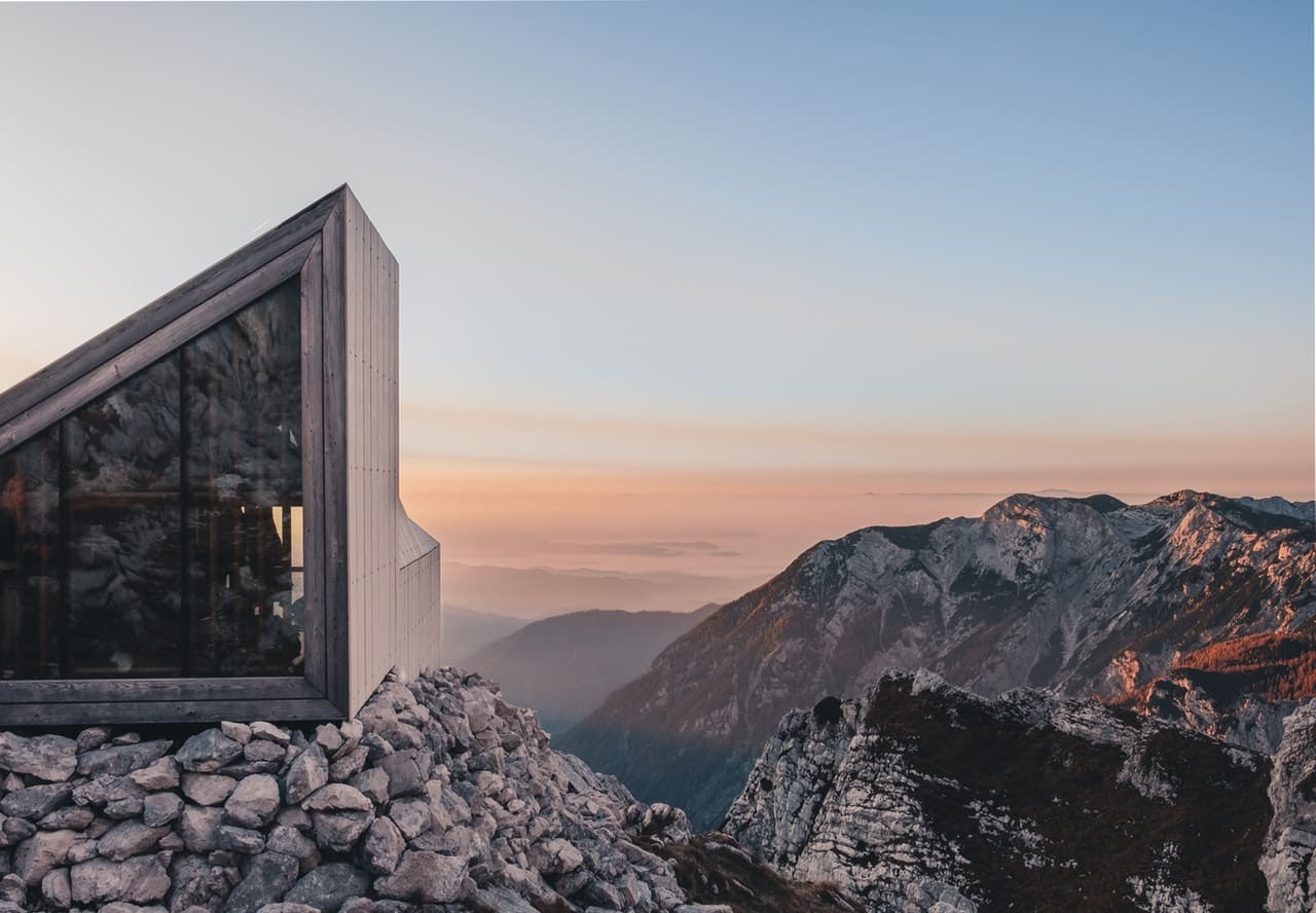 Futuristic buildings on rocks to illustrate vacuum glazing concept