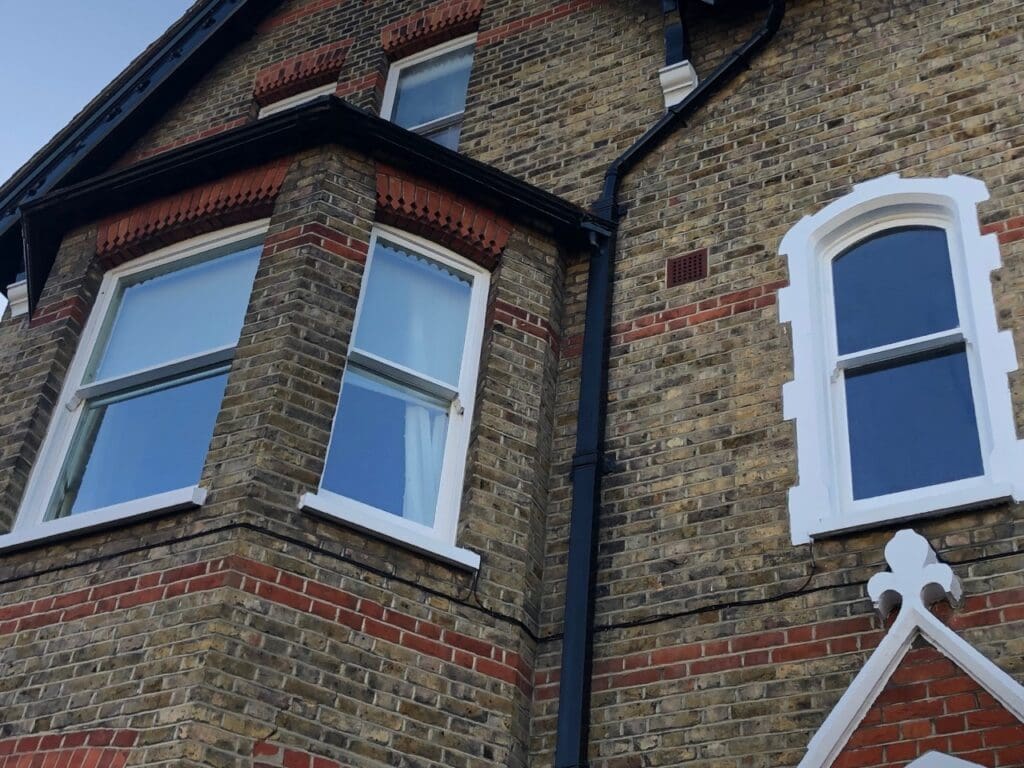 Sash window restoration in Wimbledon - front elevation of the refurbished windows