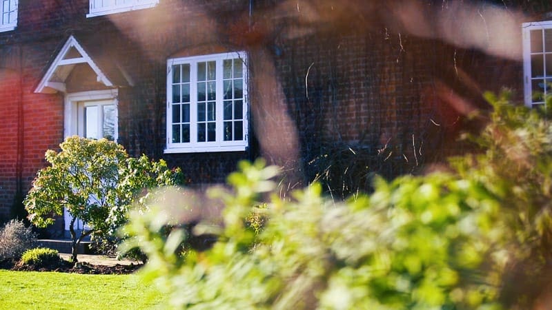 Vacuum Glazed casement windows in Kidderminster - external shot of energy efficient replacement windows from low angle in the garden