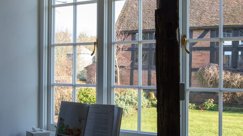Vacuum Glazed casement windows in Kidderminster - internal shot of energy efficient replacement windows showing views of the garden and historic listed building