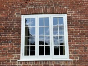 Close up photo of heritage vacuum glazing units in a restored building in London