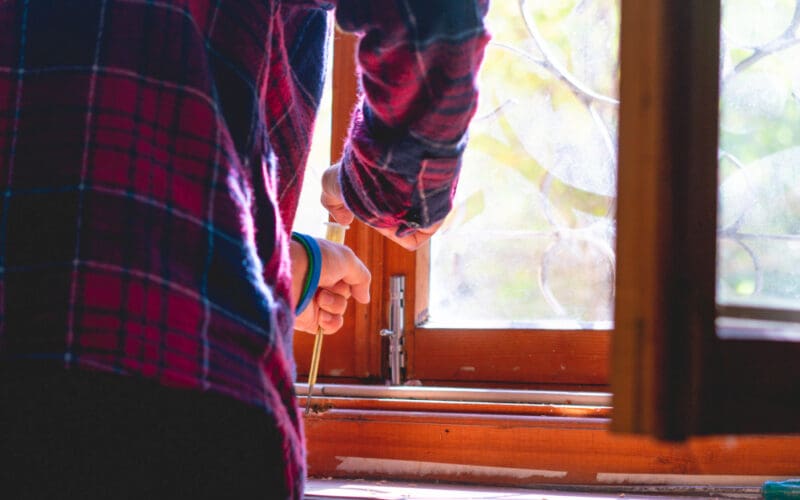 Timber window renovator repairing a window