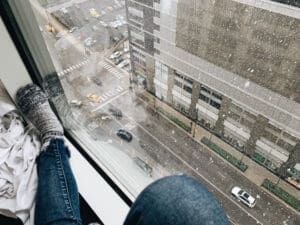 Home soundproofing with insluated glass unit igu young lady in a window with a street scene in winter